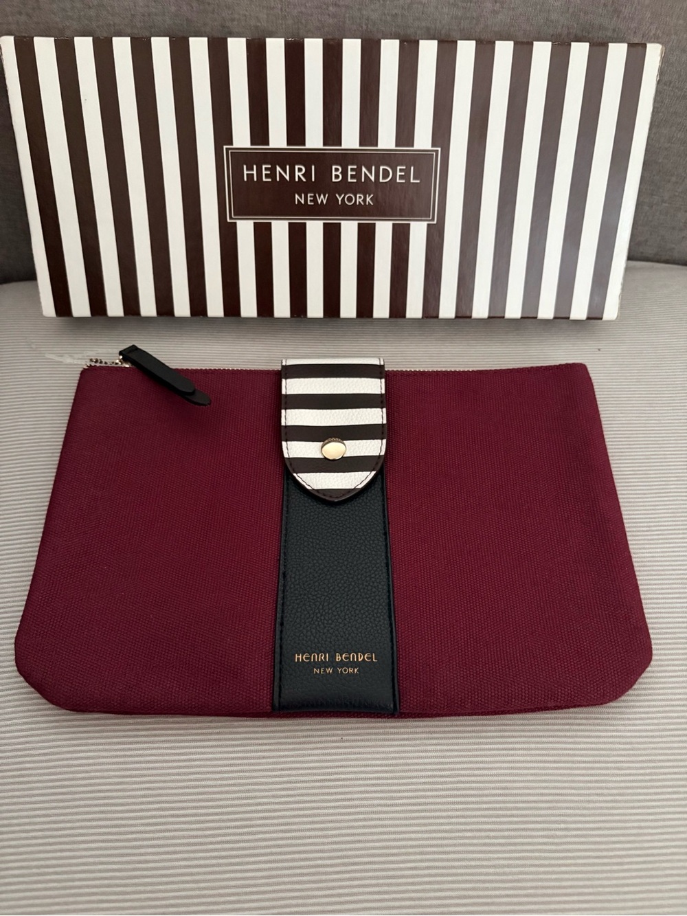 Henri Bendel Burgundy Canvas Clutch with Signature Stripe